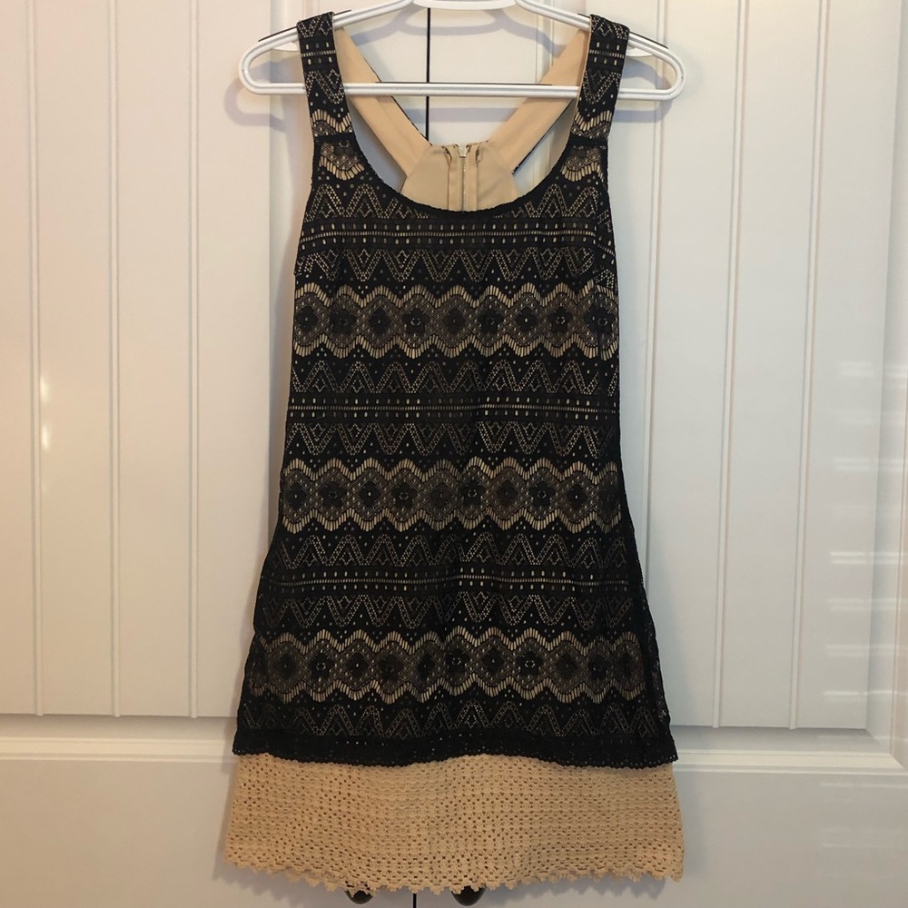 Super cute tan and black dress!